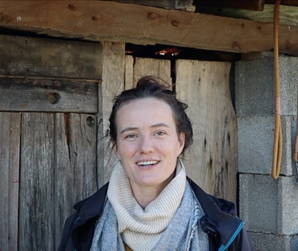 Sophie in front of dilapidated barn, The Farming Chefs