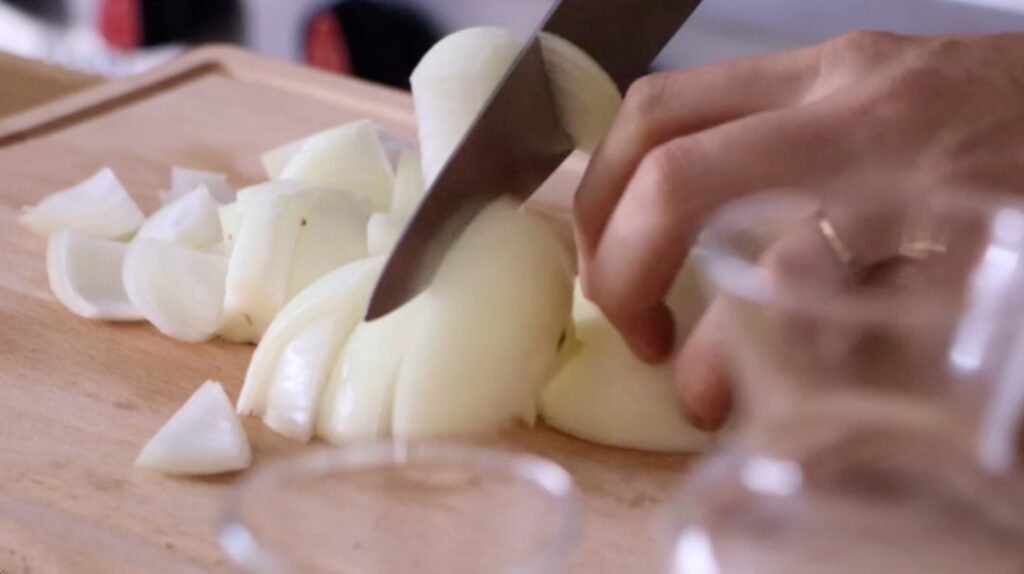 Yellow onion being chopped