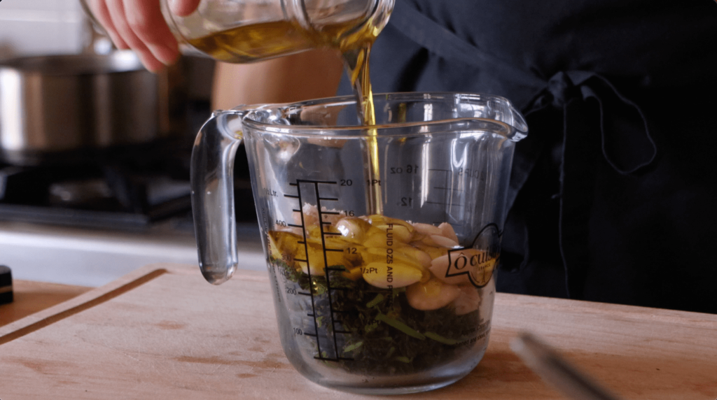 Add olive oil and boiled almonds to the carrot tops, The Farming Chefs