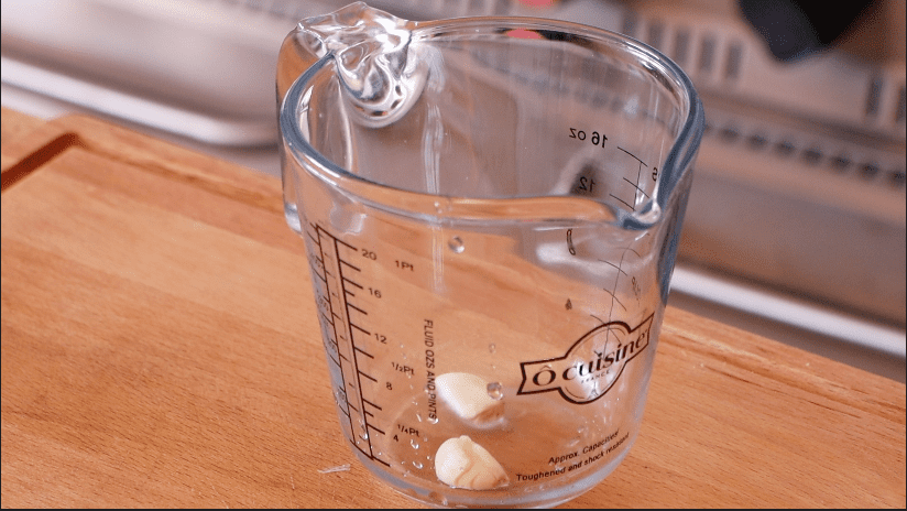 Two cloves of garlic in jar