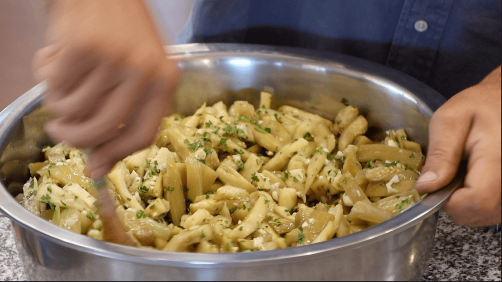 MIX ALL HERBS INTO THE COOL AUBERGINE