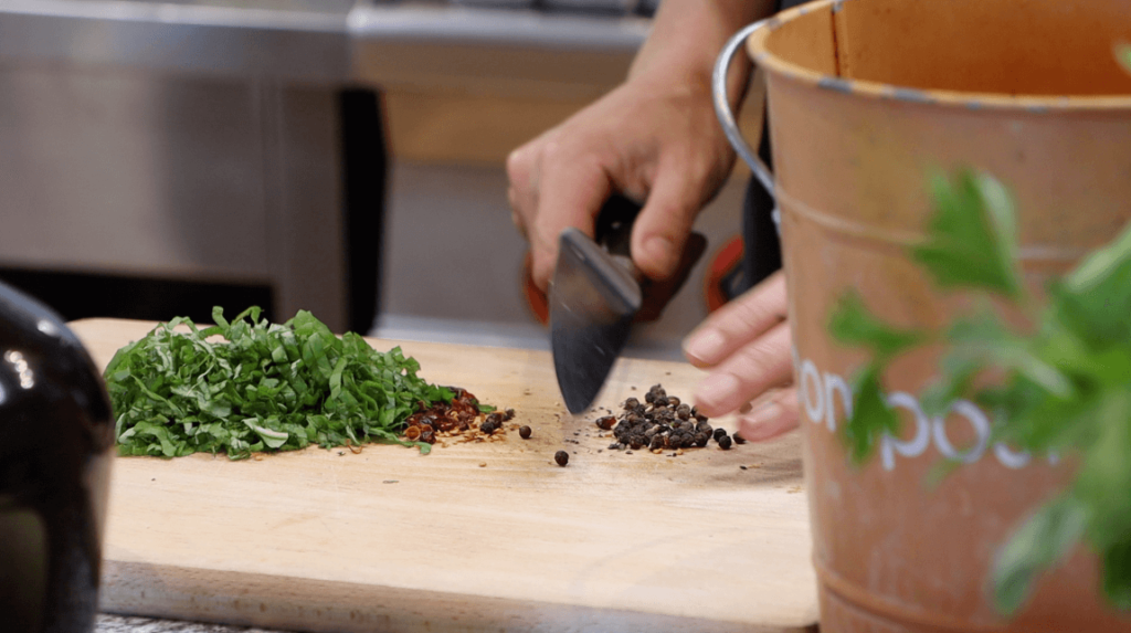 CHOP FRESH BASIL, DRIED CHILLI AND BLACK PEPPER