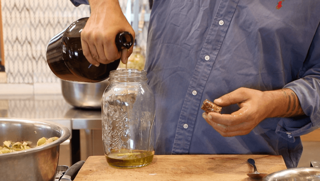 ADD OLIVE OIL INTO STERILE JAR