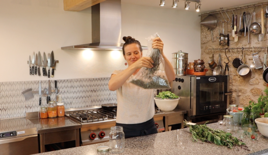 holding dried herb in