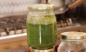 closed glass jar filled with green paste