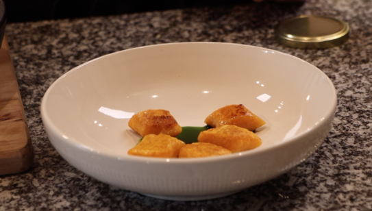 sweet potato gnocchi on basil oil