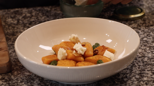 sweet potato gnocchi on basil oil