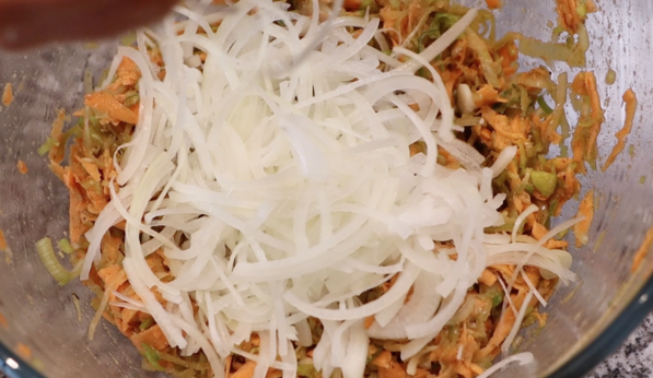 add onions to shredded sweet potato and leek mixture