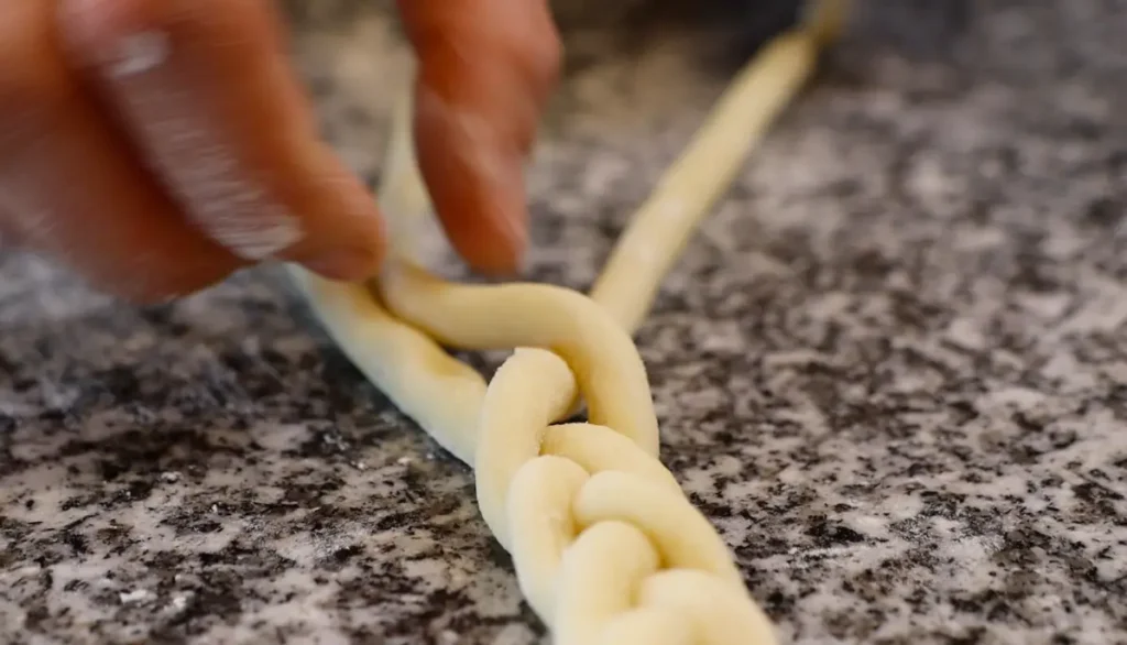 making a plait from dough