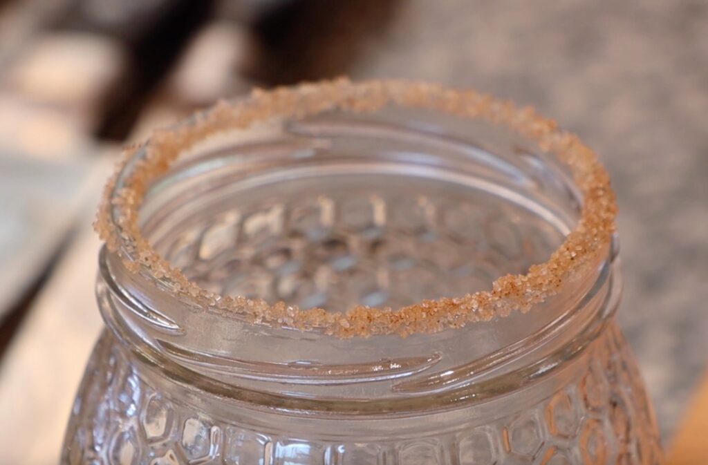 decorated edge of glass jar with sugar