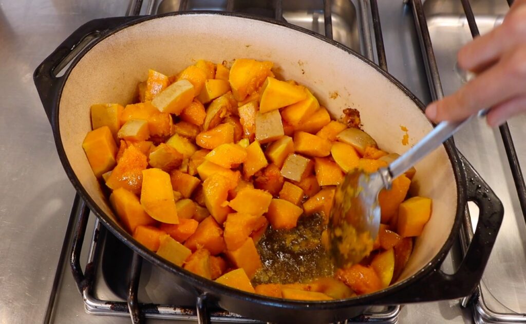 oval pot, pumpkin pieces, bottom of pot visible on the right side