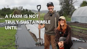 Two-Farmers-Holding-Tools-in-Sustainable-Market-Garden
