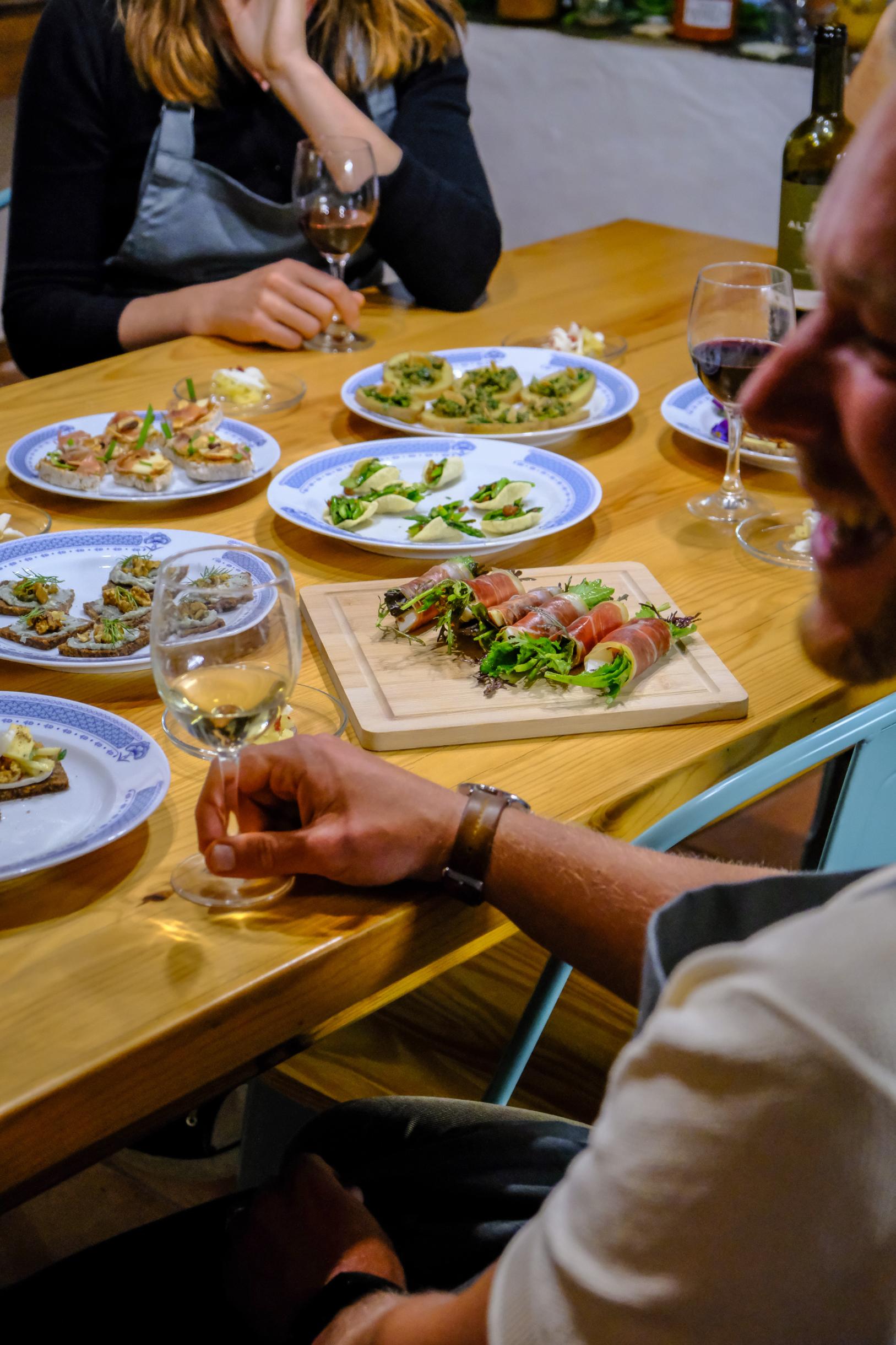 RETREAT GUESTS ENJOYING DINNER AT TABLE TOGETHER