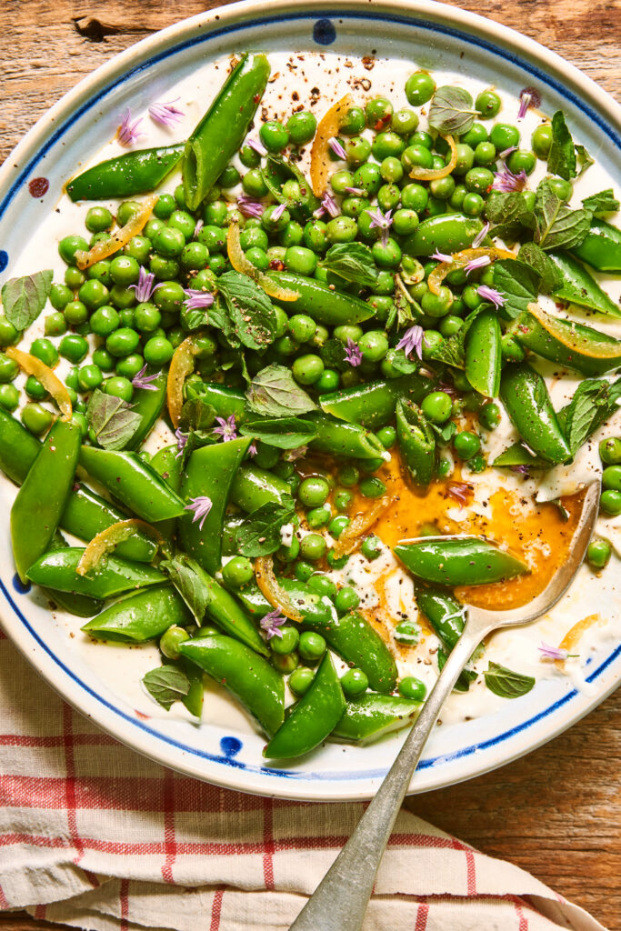 Snap pea and pea salad with herbs, edible flowers and yogurt