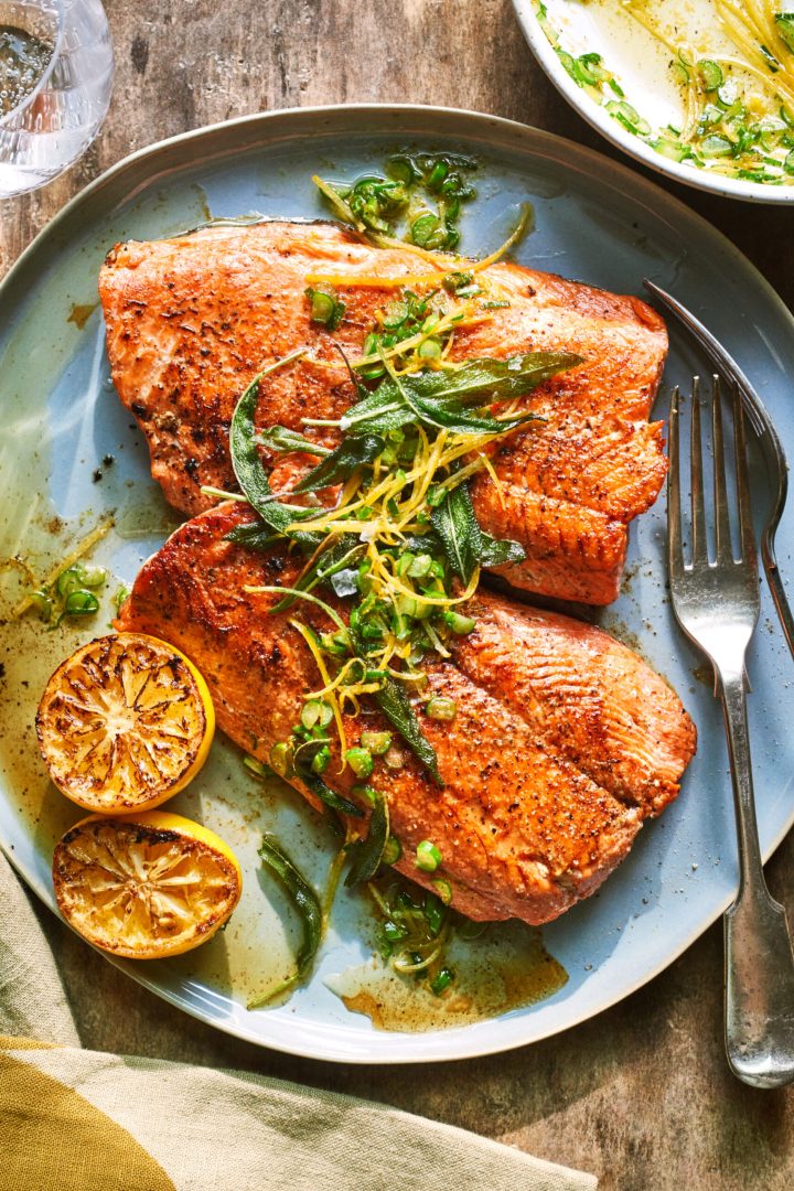Seared wild salmon fillets topped with sage and lemon gremolata